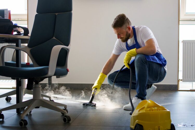 professional-cleaning-service-person-using-steam-cleaner-office1