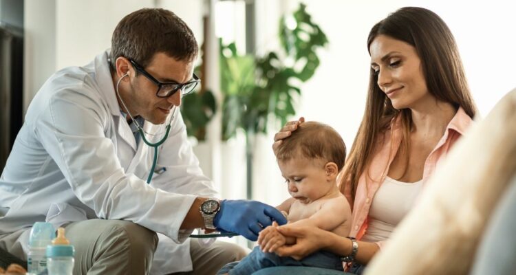baby-boy-getting-medical-exam-by-doctor-while-being-with-mother-pediatrician-s